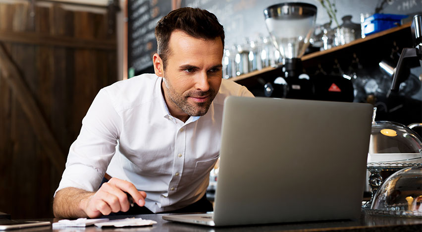 restaurant employee on laptop